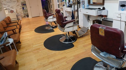 Cozy salon chairs at All That Beauty Bar, Ottawa, Ontario, CA with a chic, modern interior.