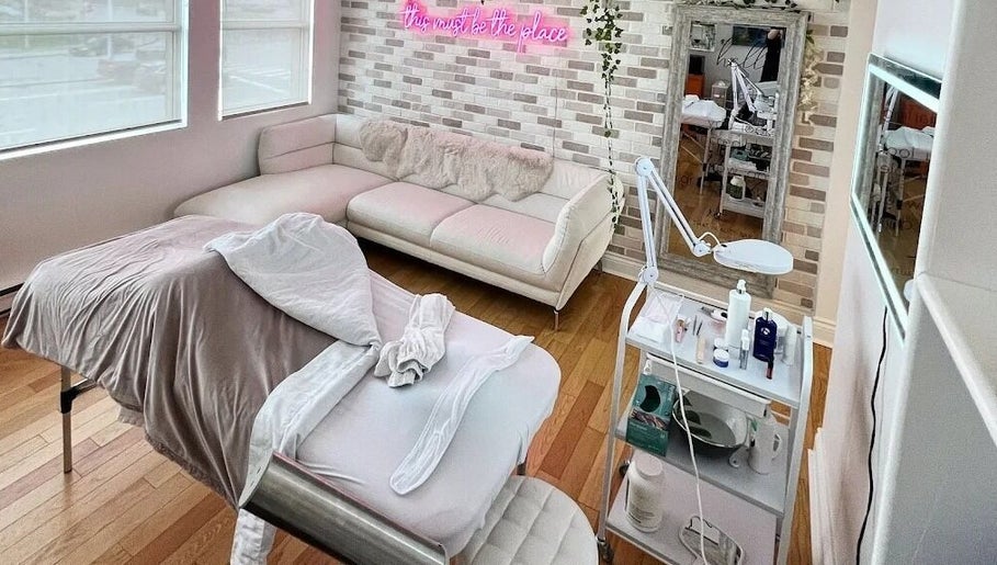 Cozy spa room with treatment bed at All That Beauty Bar, Ottawa, Ontario, CA, perfect for relaxation.