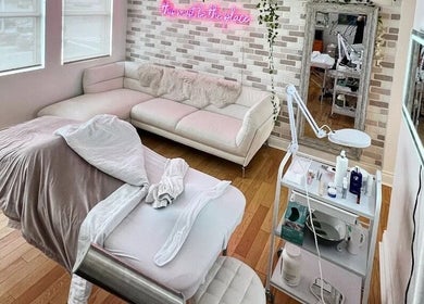 Cozy spa room with treatment bed at All That Beauty Bar, Ottawa, Ontario, CA, perfect for relaxation.