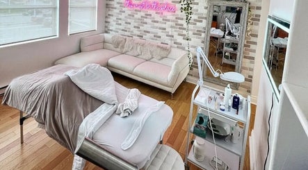 Cozy spa room with treatment bed at All That Beauty Bar, Ottawa, Ontario, CA, perfect for relaxation.