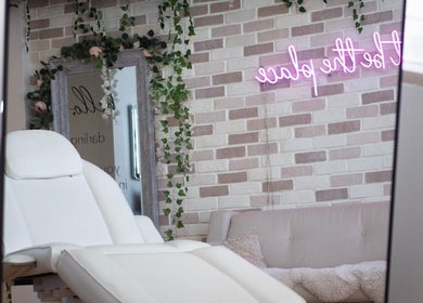 Relaxing salon interior at All That Beauty Bar, Ottawa, Ontario, CA with elegant decor and comfy seating.