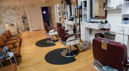 Spacious salon area at All That Beauty Bar, Ottawa, Ontario, CA with modern decor and styling chairs.
