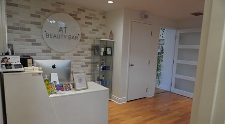 Reception area at All That Beauty Bar in Ottawa, Ontario, CA with modern decor and beauty products.
