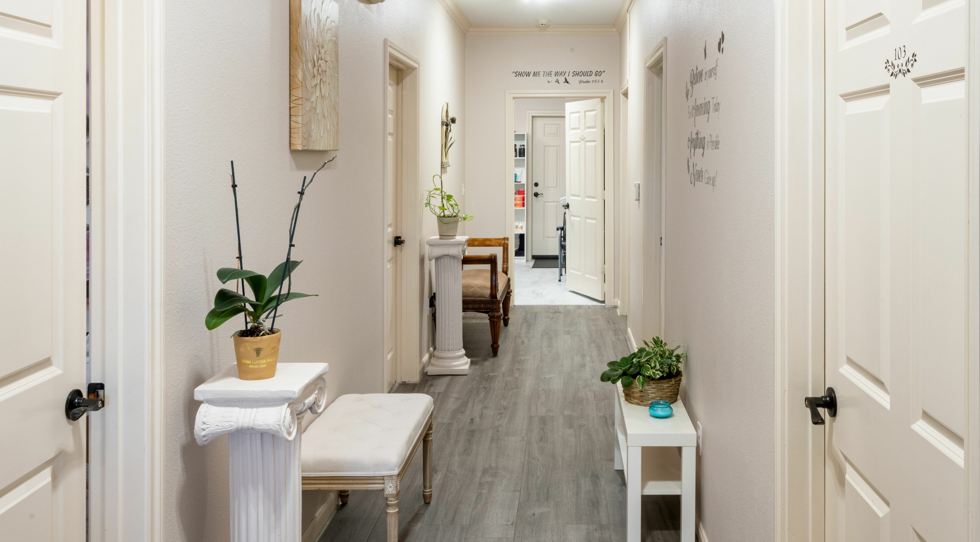 Bright, elegant hallway at Ageless Envy Retreat Med Spa in Katy, Texas, US with calming decor and greenery.