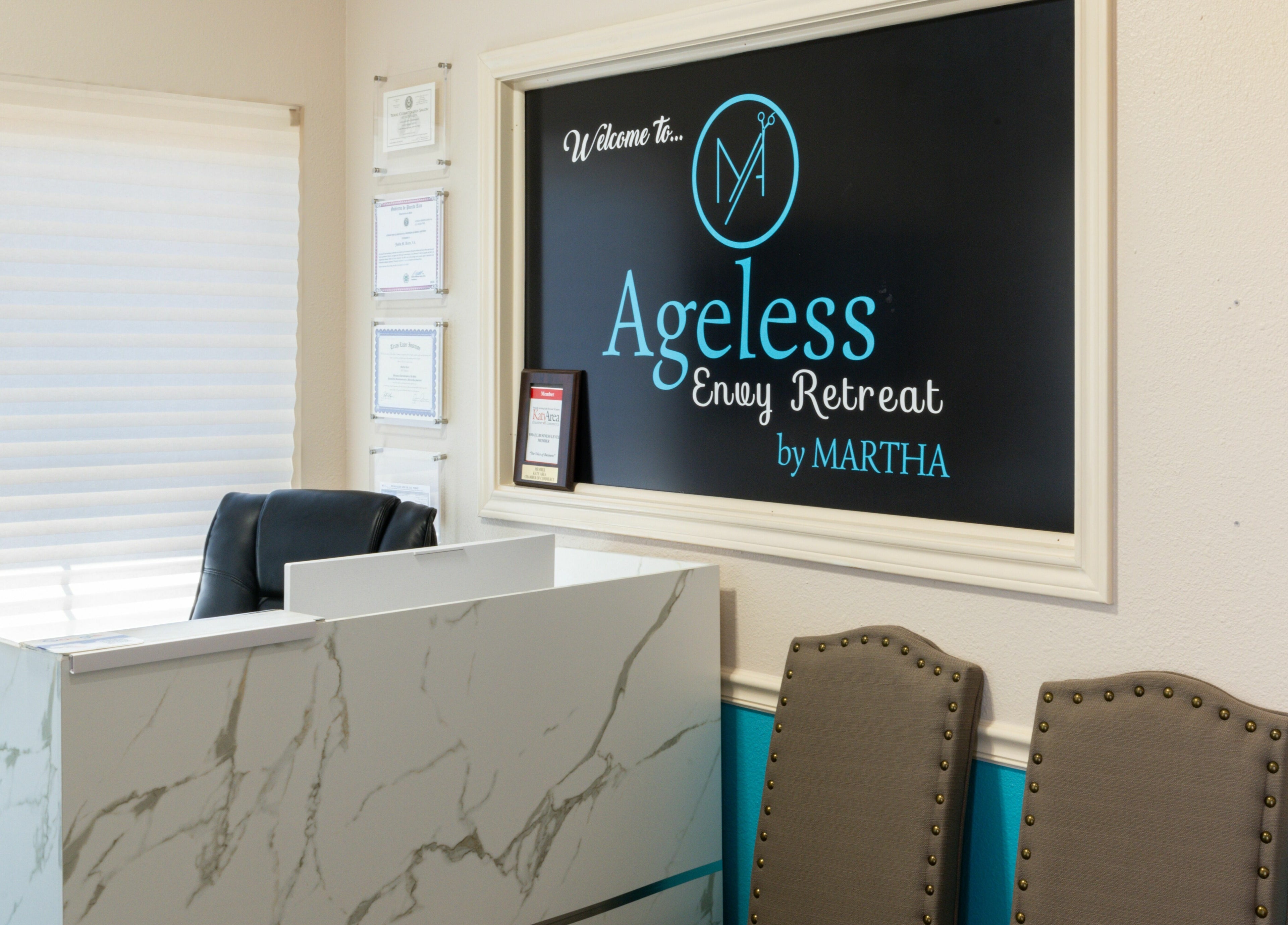Reception area of Ageless Envy Retreat Med Spa in Katy, Texas, US with modern decor and welcoming sign.