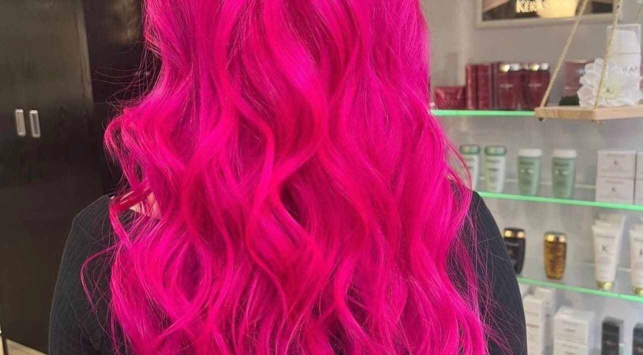 Bright pink wavy hairstyle at FLD - Hair by Freya Chobham, Chobham, England, GB.
