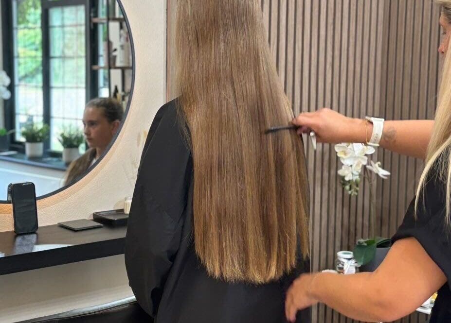 Stylist perfecting long hair at FLD - Hair by Freya Chobham, Chobham, England, GB.