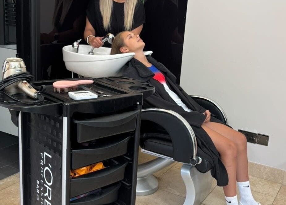 Relaxing wash at FLD - Hair by Freya Chobham in Chobham, England, GB. A client leans back for a hair wash.