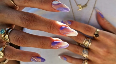 Elegant purple and white manicure at Studio Ten, Auckland, Auckland, NZ, showcasing stylish nail art.