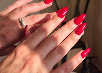Red polished nails at Studio Ten, Auckland, Auckland, NZ highlighting exceptional nail artistry.