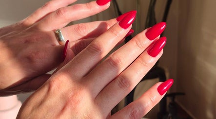 Red polished nails at Studio Ten, Auckland, Auckland, NZ highlighting exceptional nail artistry.