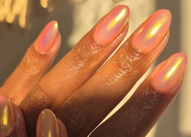 Stunning holographic nails at Studio Ten, Auckland, Auckland, NZ, reflecting vibrant colors in sunlight.