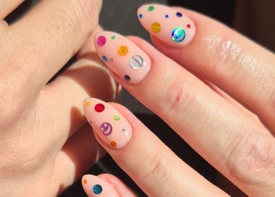 Colorful nail art at Studio Ten, Auckland, Auckland, NZ, showcasing vibrant dots and elegant design.