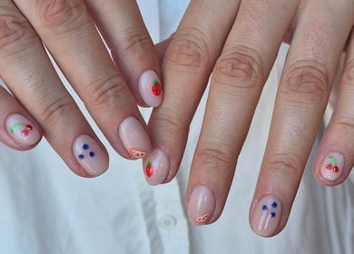 Fruit-themed nail art from Studio Ten in Auckland, Auckland, NZ showcasing cherries and strawberries.