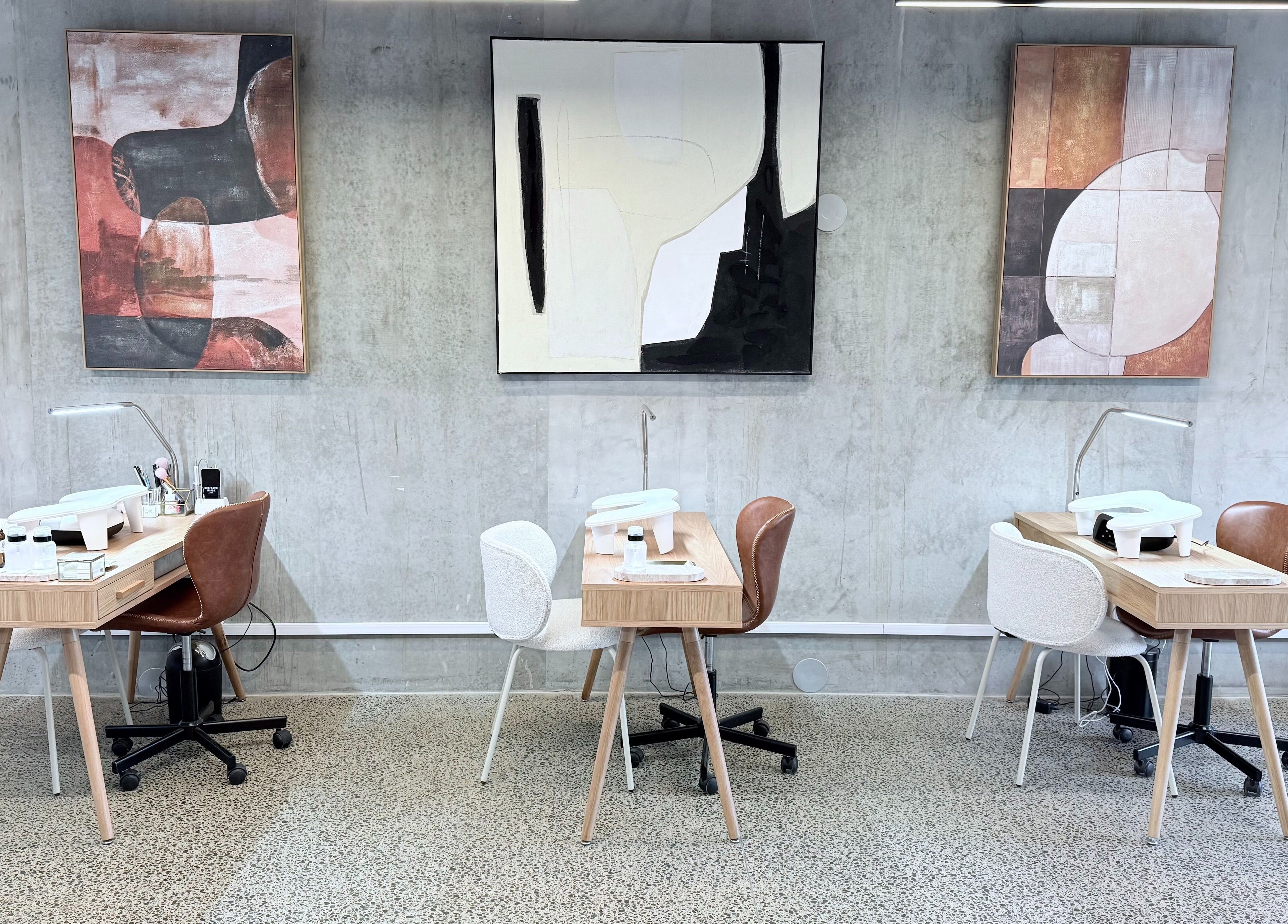 Stylish nail stations at Studio Ten, Auckland, Auckland, NZ featuring modern art and sleek design.