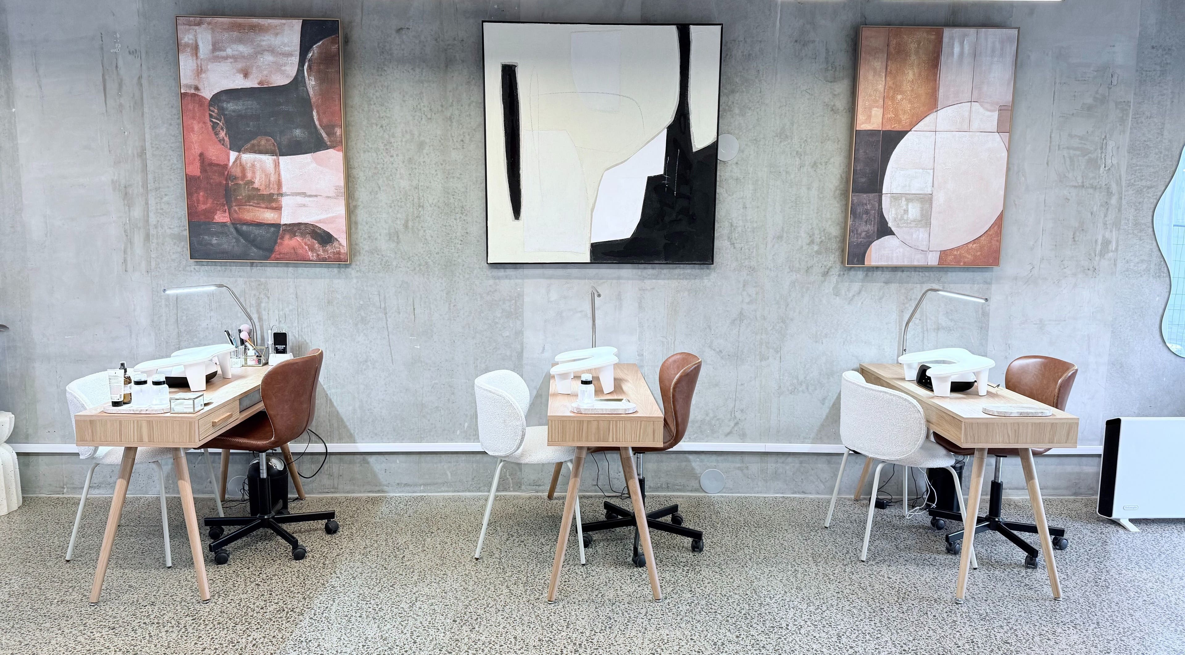 Stylish nail stations at Studio Ten, Auckland, Auckland, NZ featuring modern art and sleek design.
