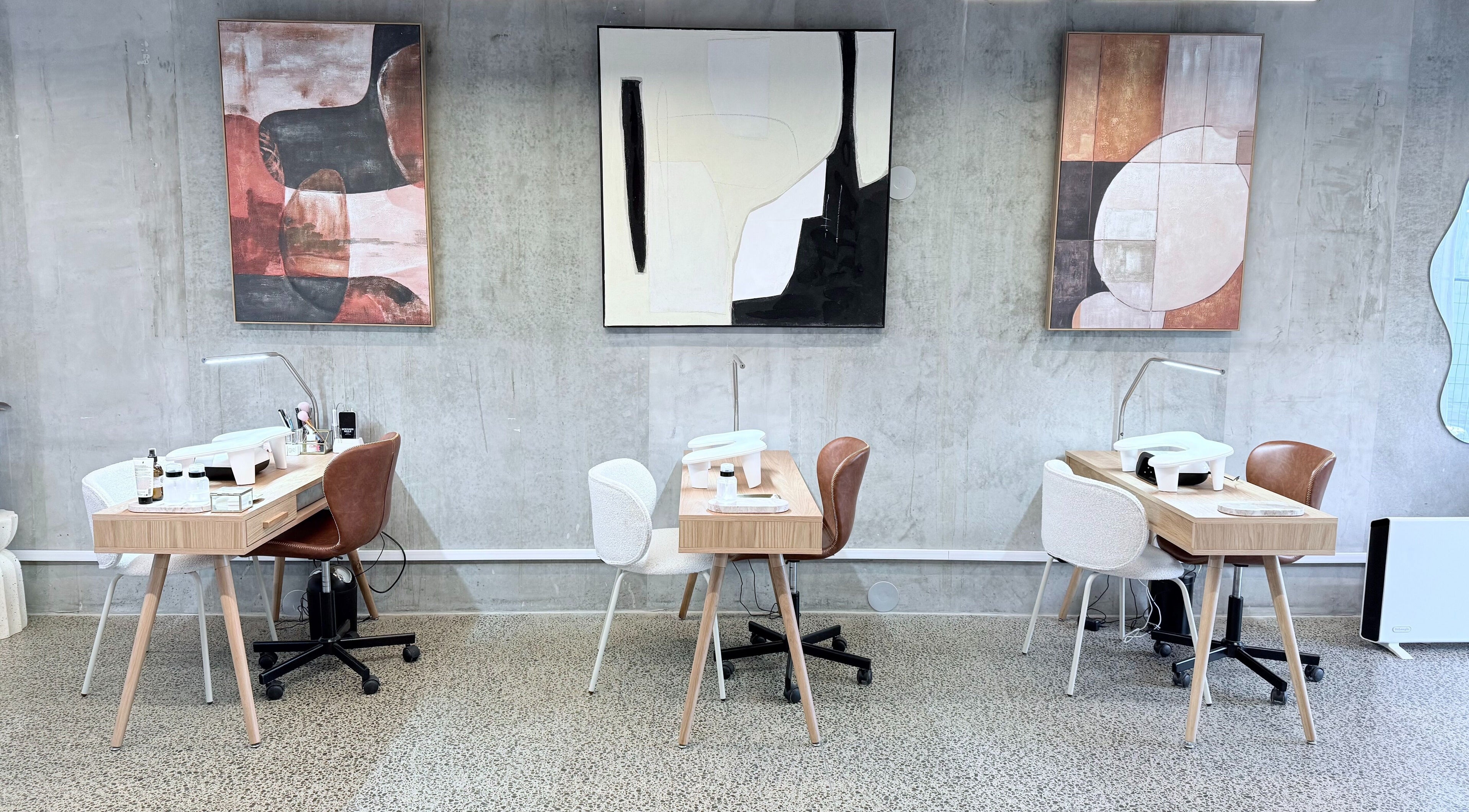 Stylish nail stations at Studio Ten, Auckland, Auckland, NZ featuring modern art and sleek design.
