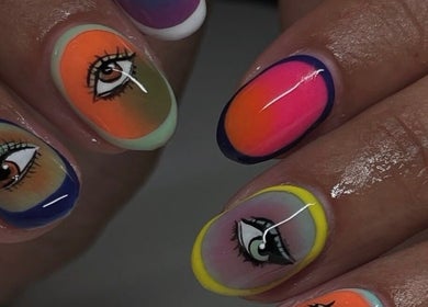 Colorful eye-themed nail art at Tech Nailz in Cardiff, Wales, GB, featuring bold designs and hues.