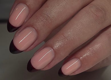 Elegant French manicure at Tech Nailz, Cardiff, Wales, GB, featuring sleek black tips.