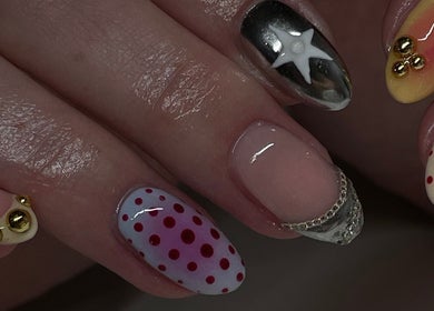 Artistic nail designs with patterns and embellishments at Tech Nailz, Cardiff, Wales, GB.
