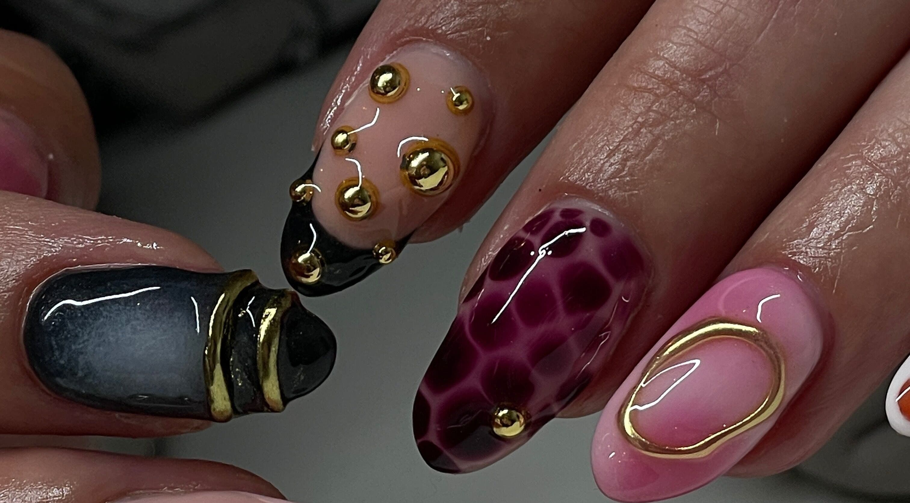 Elegant nail designs with gold accents at Tech Nailz, Cardiff, Wales, GB. Perfect for a stunning look.