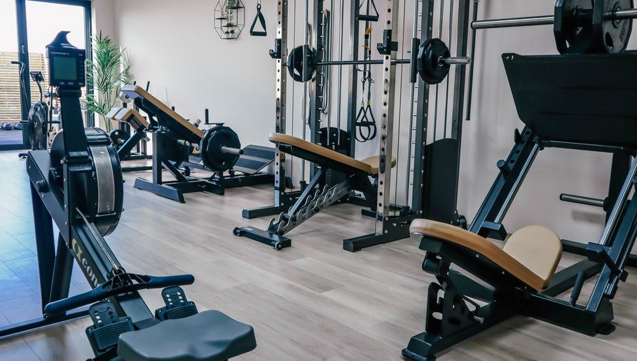 Spacious gym area at Gfit in Lavernock, Wales, GB equipped with state-of-the-art fitness machines.