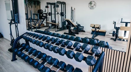 Gfit gym in Lavernock, Wales, GB, features modern strength training equipment and a well-organized dumbbell rack.