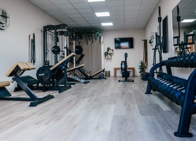 Modern gym at Gfit with equipment and plants in Lavernock, Wales, GB.