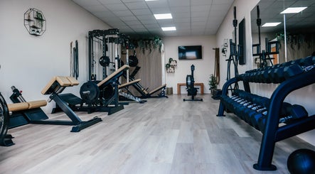 Modern gym at Gfit with equipment and plants in Lavernock, Wales, GB.