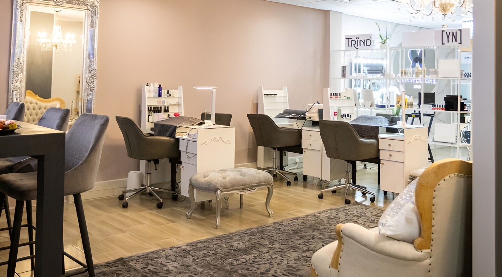 Chic nail salon area at Cinnedene Studios, Centurion, Gauteng, ZA, showcasing stylish chairs and decor.