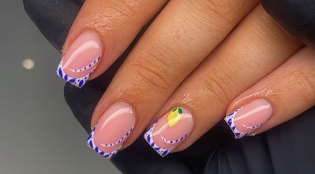 Colorful nail art with blue, white, and lemon design at Lois Rigby Beauty in Bury, England, GB.