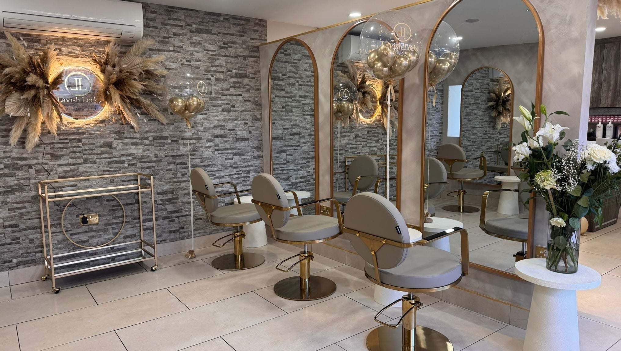 Stylish interior of Lavish Locks Ardee in County Louth, showcasing elegant salon chairs and decor.