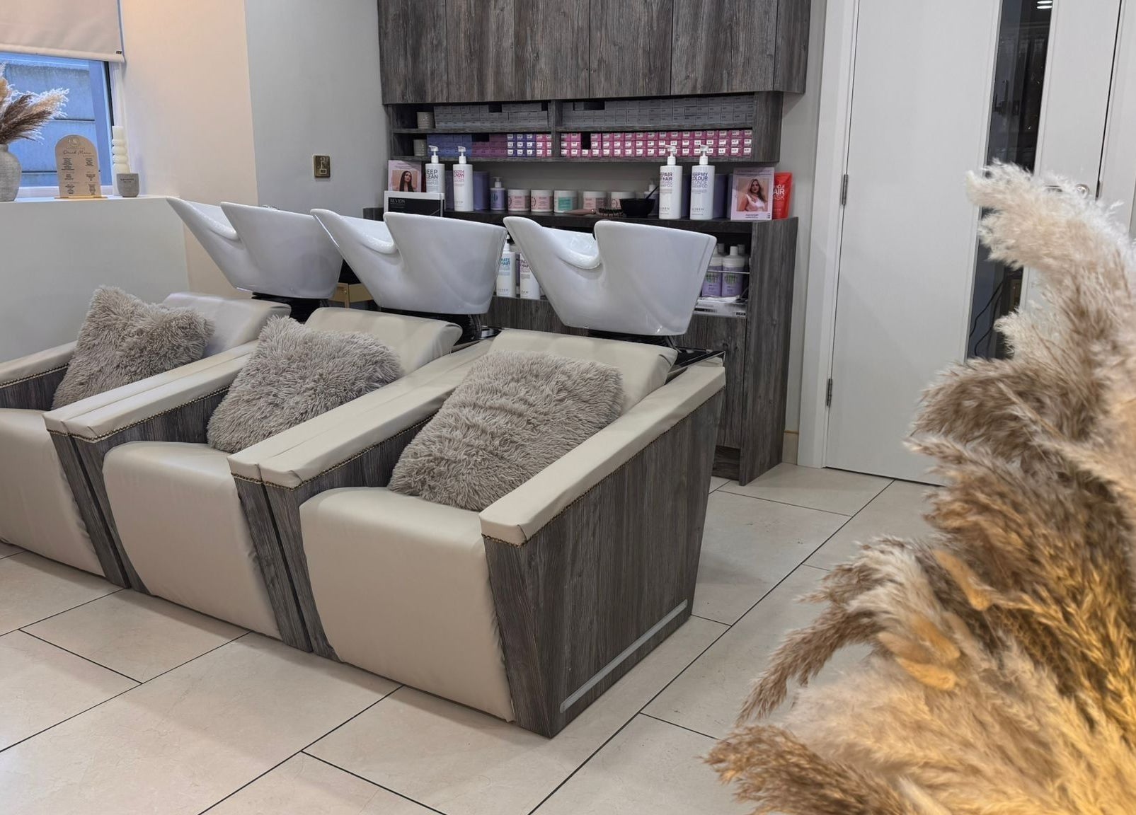 Luxurious washstations at Lavish Locks Ardee in County Louth, IE, offering a relaxing beauty experience.