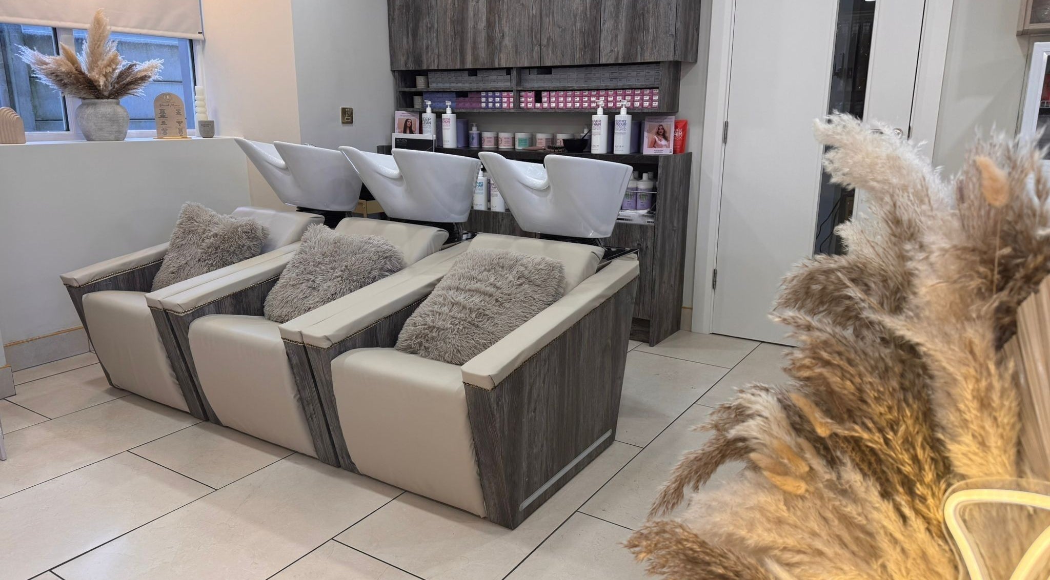 Luxurious washstations at Lavish Locks Ardee in County Louth, IE, offering a relaxing beauty experience.