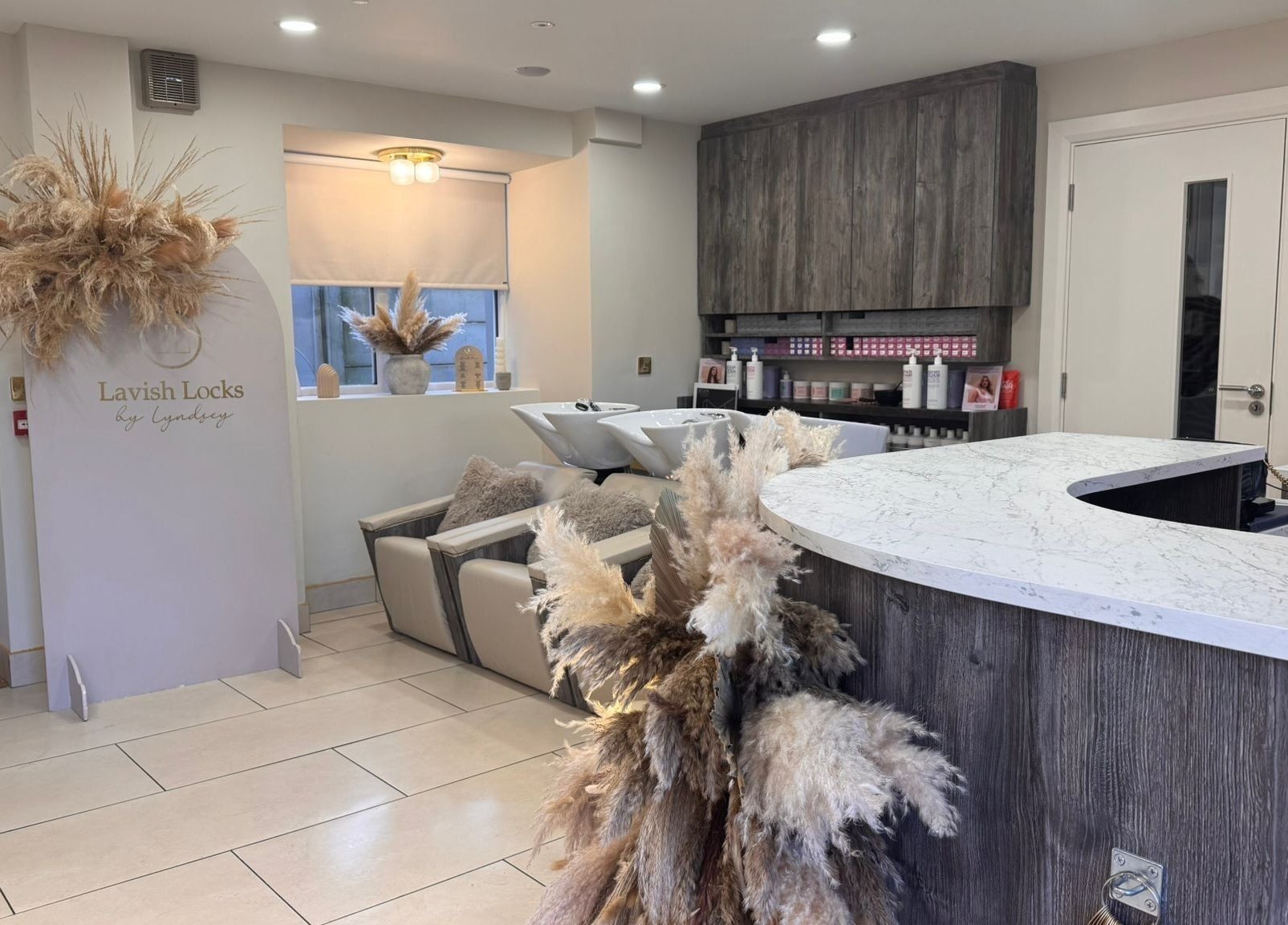 Interior of Lavish Locks Ardee in County Louth, inviting decor with warm tones and stylish seating.