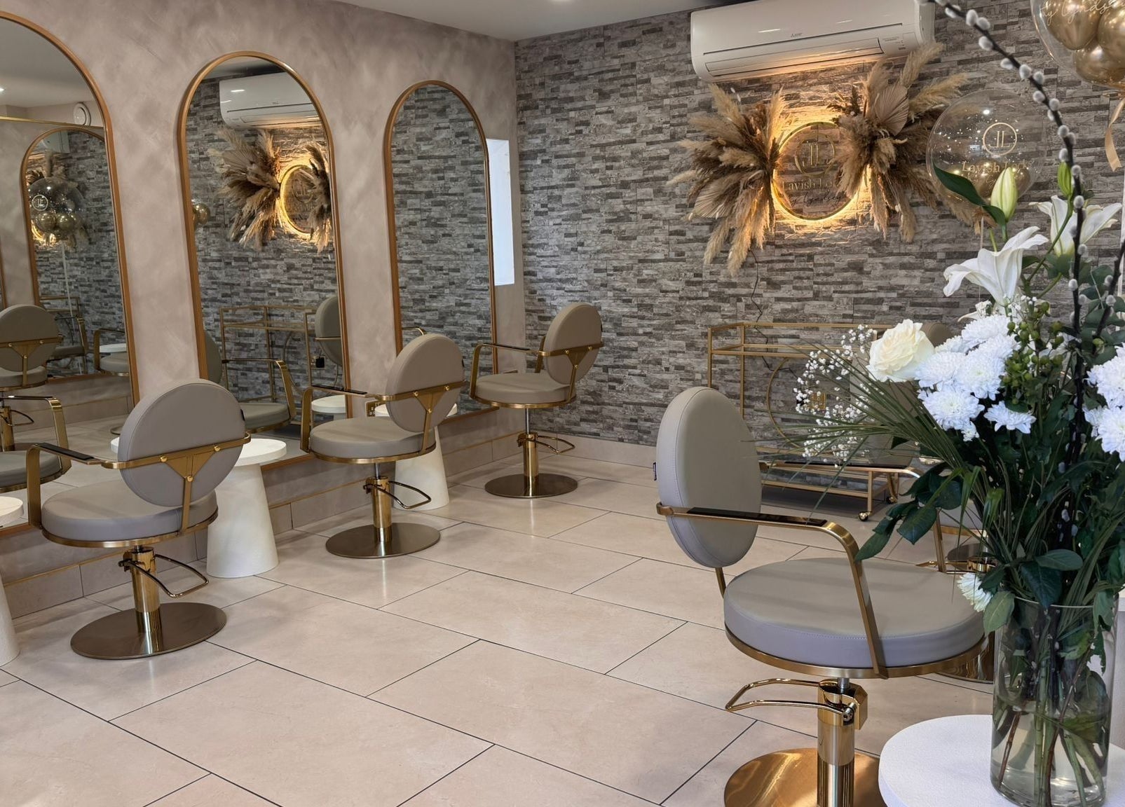 Lavish Locks Ardee salon in County Louth, IE, featuring chic seating, elegant mirrors, and floral decor.
