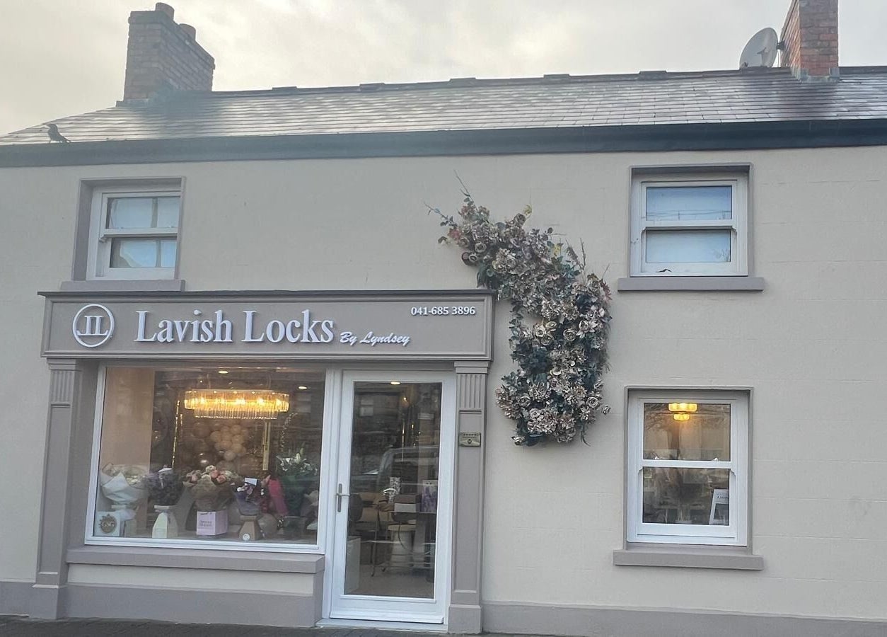 Exterior of Lavish Locks Ardee in County Louth, featuring stylish signage and floral decor.