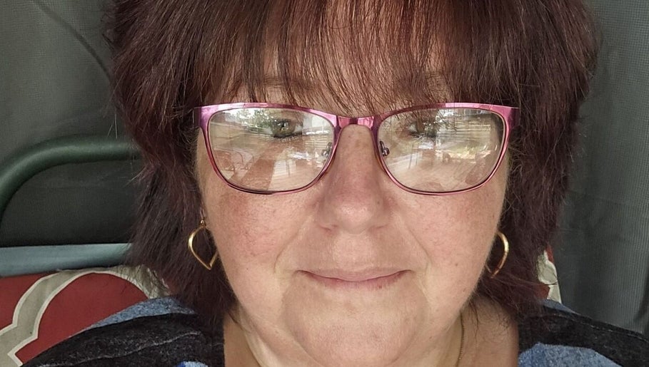 Relax With Melissa beautician in Windsor, Ontario, CA, smiling with pink glasses.