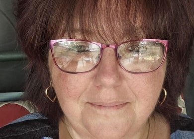 Relax With Melissa beautician in Windsor, Ontario, CA, smiling with pink glasses.