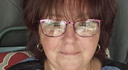 Relax With Melissa beautician in Windsor, Ontario, CA, smiling with pink glasses.