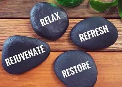 Relaxation stones at Relax With Melissa, Windsor, Ontario, CA, promoting rejuvenation and wellness.