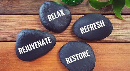 Relaxation stones at Relax With Melissa, Windsor, Ontario, CA, promoting rejuvenation and wellness.