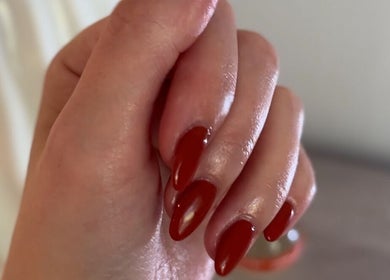 Red manicured nails at Valentina Beauté, Montréal, Québec, CA showcasing luxury nail services.