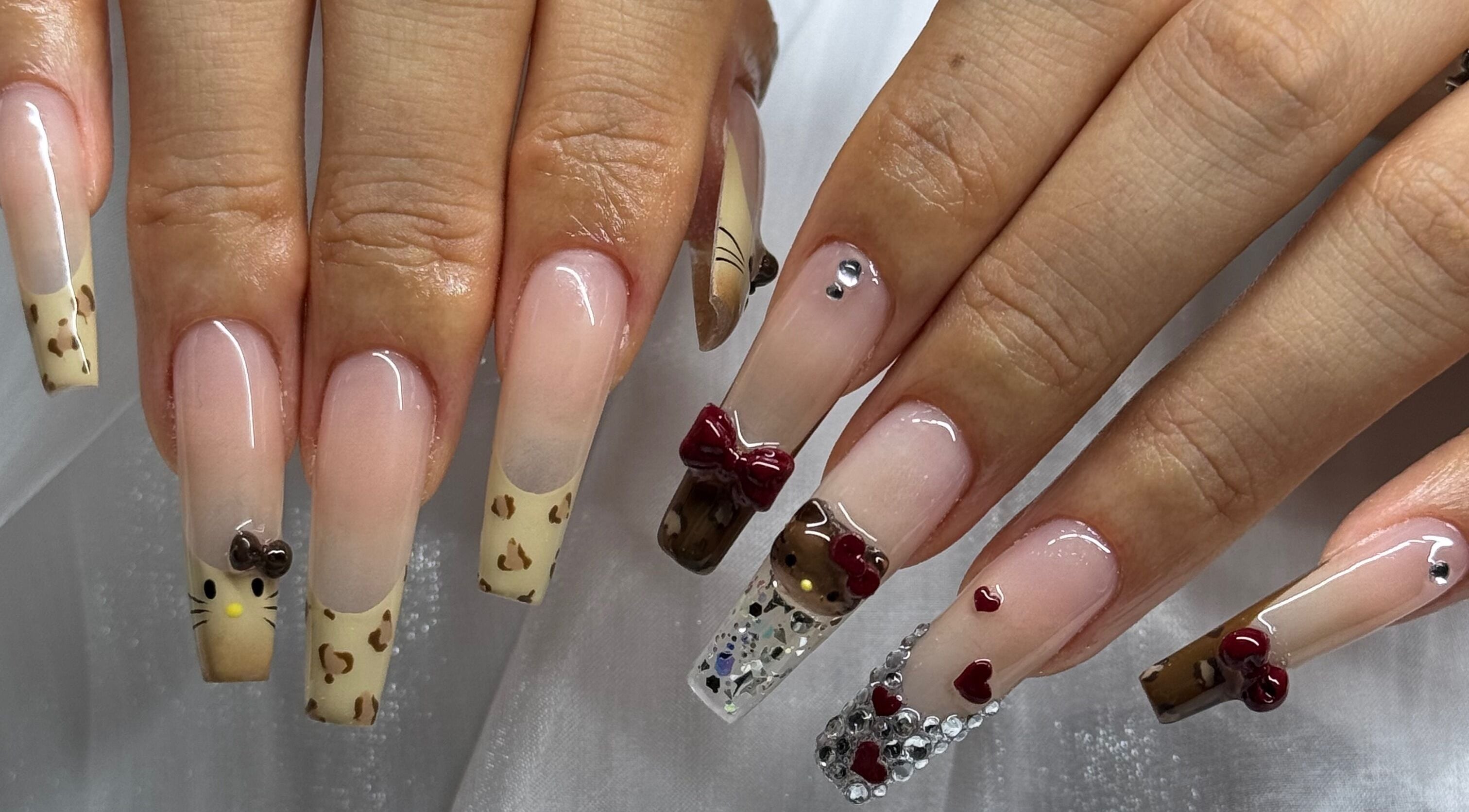 Creative nail art featuring bows and embellishments at Luna Atelier, Burnaby, British Columbia, CA.