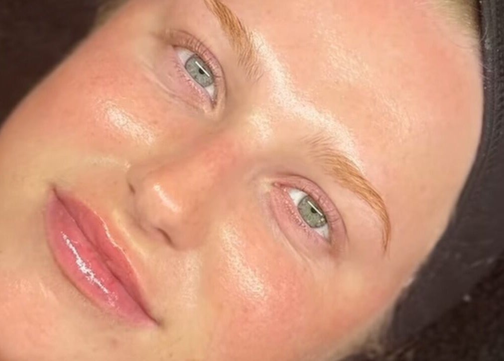 Client with glowing skin at Harley’s Lash Lounge, Nuneaton, England, GB, post-beauty treatment.