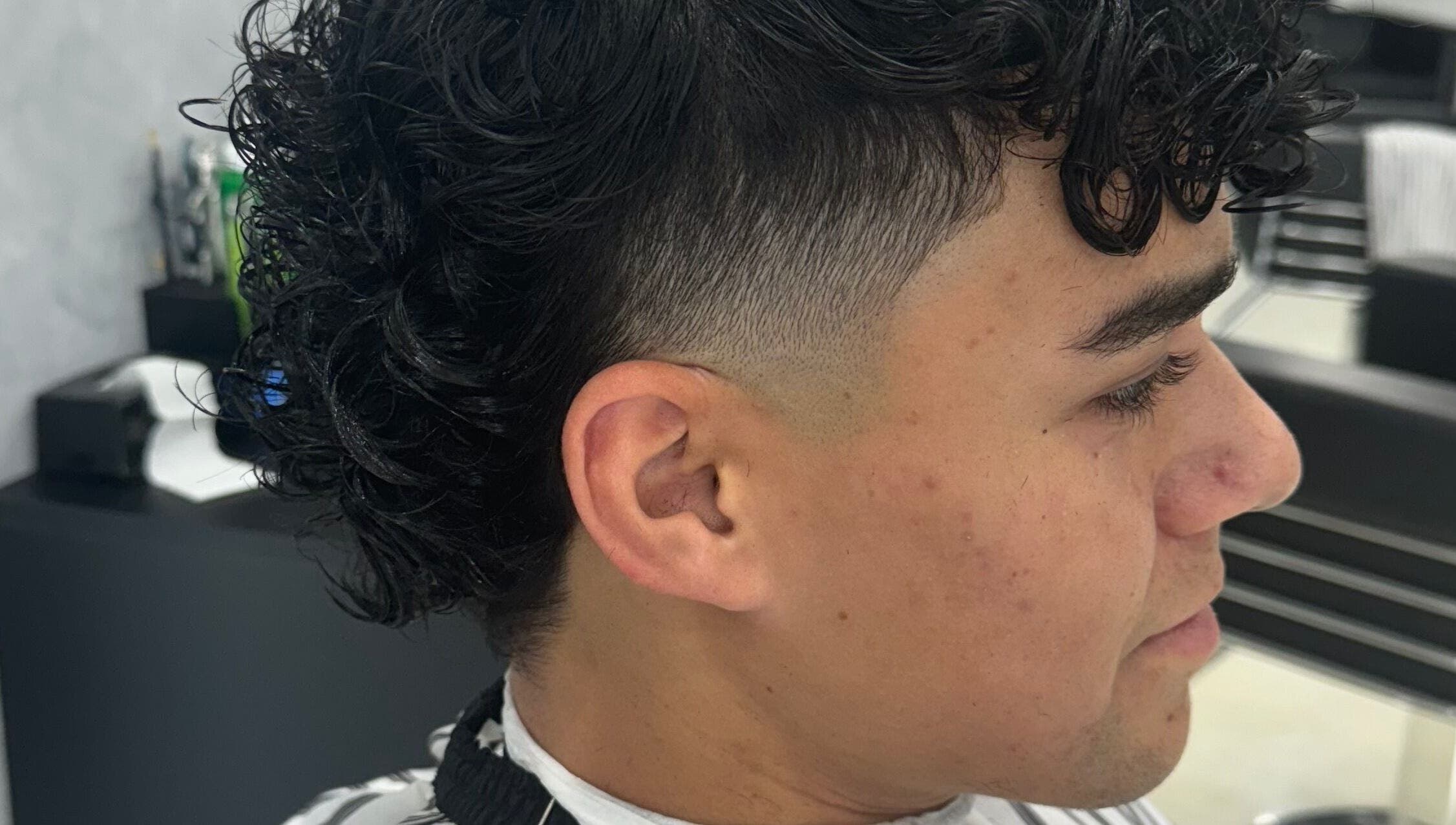 Close-up of a fresh fade haircut with curls at Elivate Studio, Nobleton, Ontario, CA.