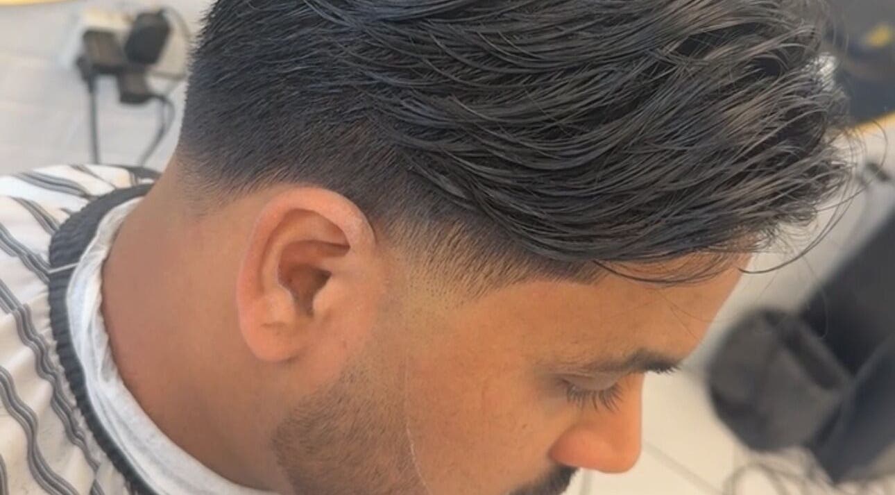 Close-up of stylish fade haircut at Elivate Studio, Nobleton, Ontario, CA offering expert grooming services.