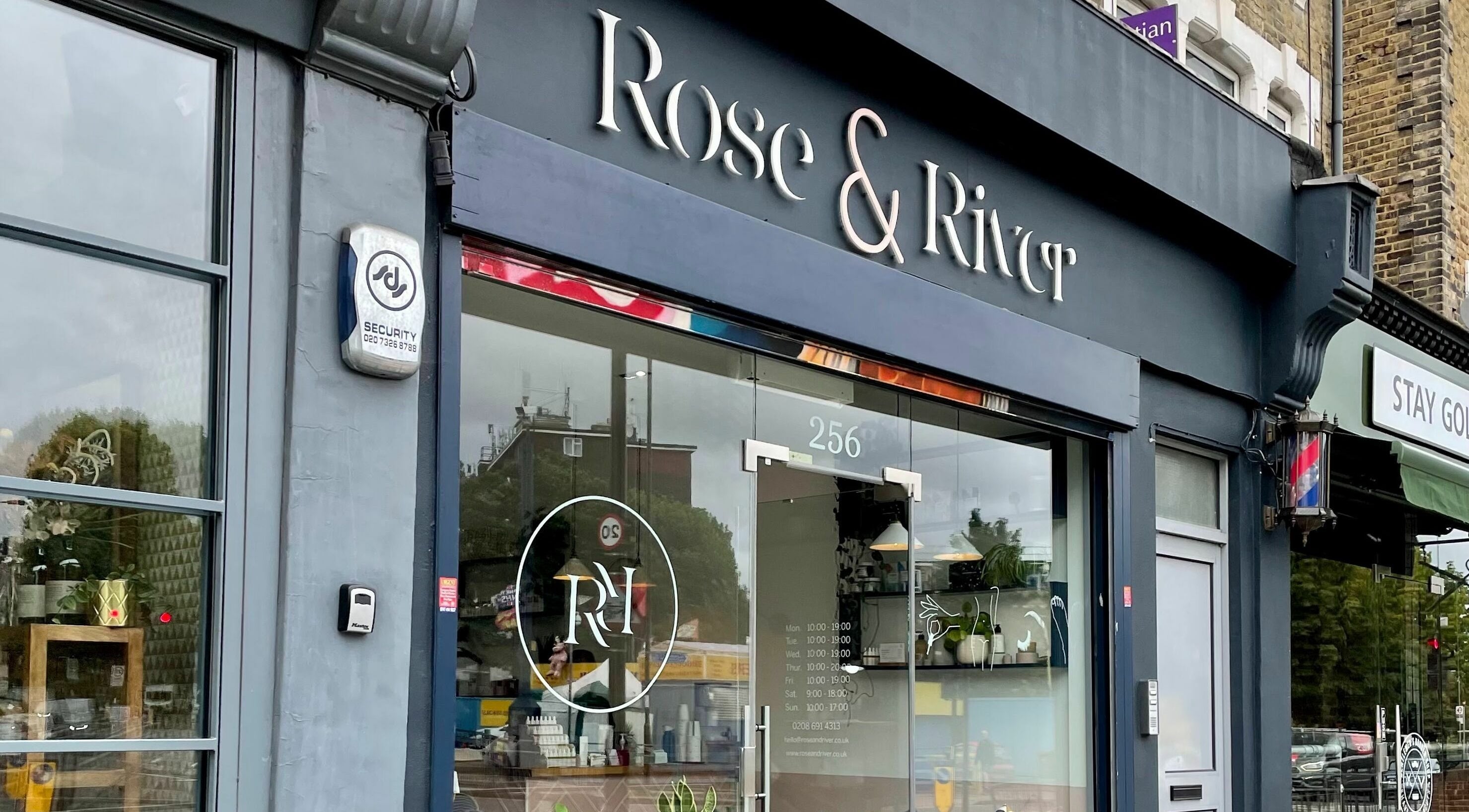 Elegant storefront of Rose and River in London, England, GB featuring glass entrance and modern signage.