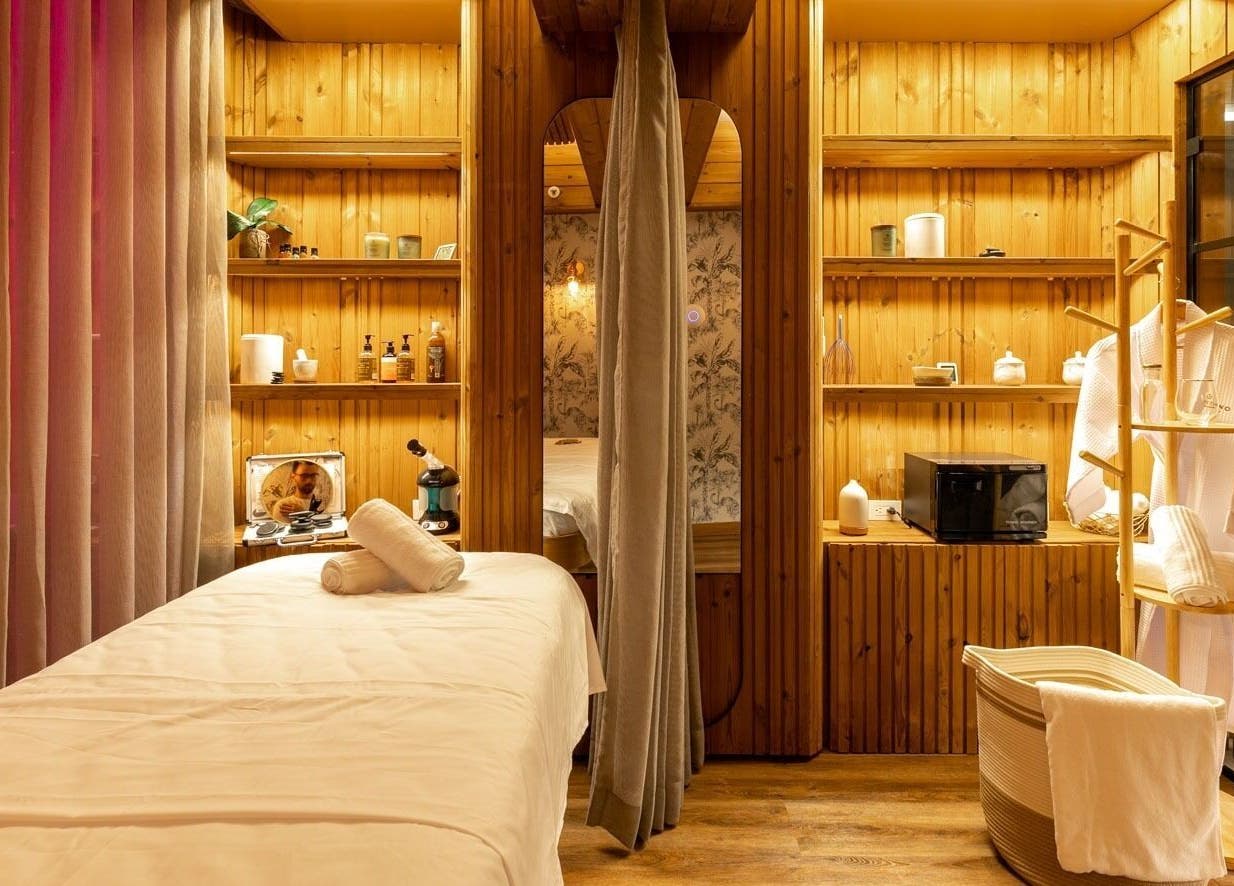 Relaxing spa room at Celestino Spa, Medellín, Antioquia, CO, featuring massage table and ambient lighting.