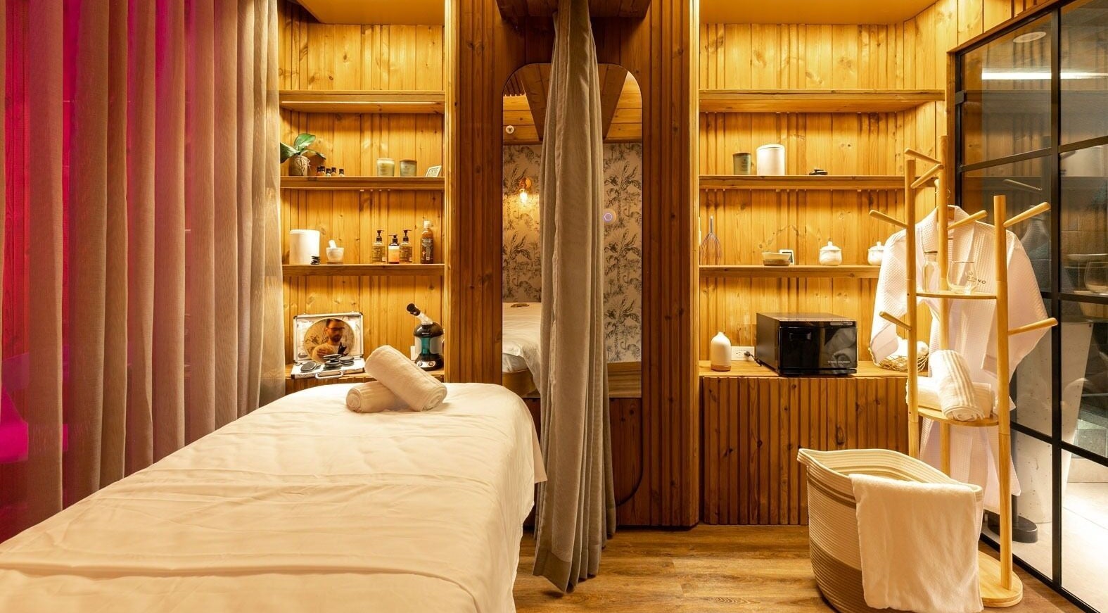 Relaxing spa room at Celestino Spa, Medellín, Antioquia, CO, featuring massage table and ambient lighting.